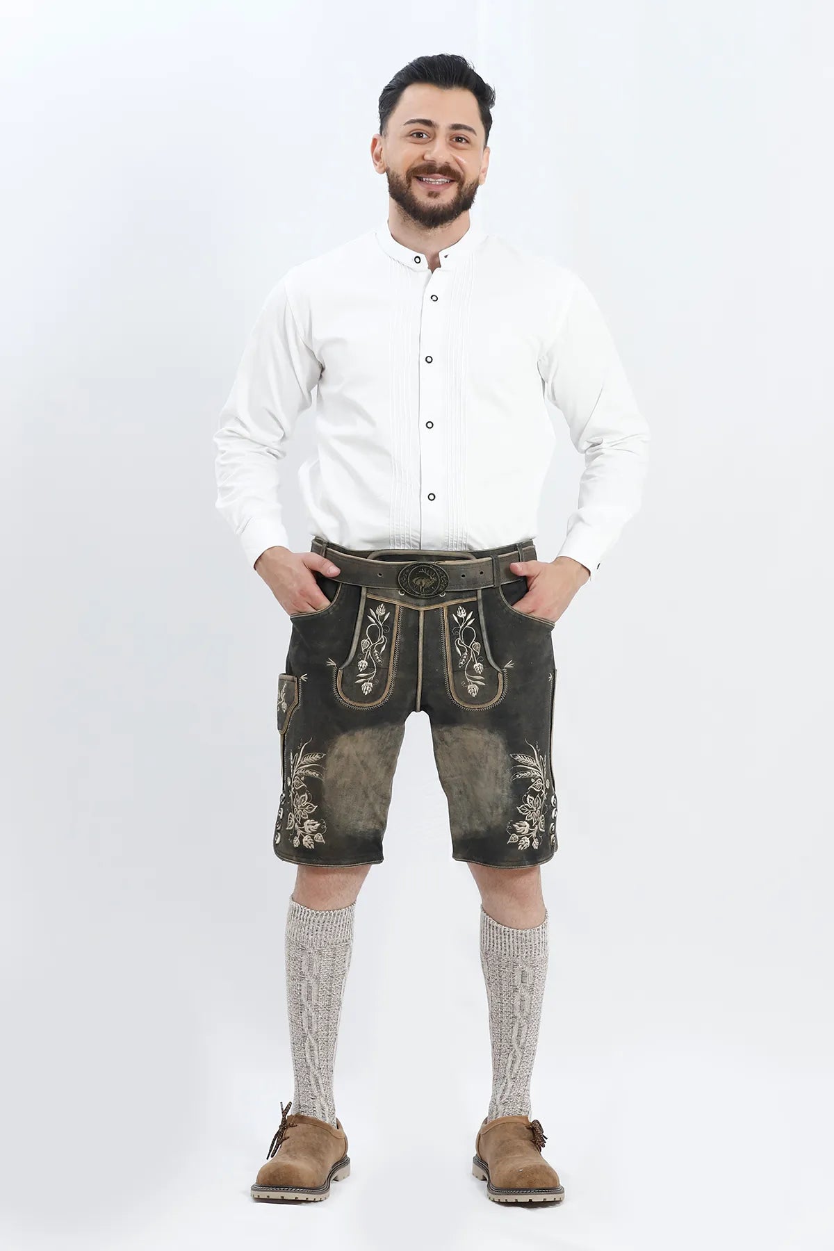 Lederhosen Men in Charcoal Black with Traditional Embroidery. Model is wearing White Traditional Shirt with Bavarian Socks and Shoes.